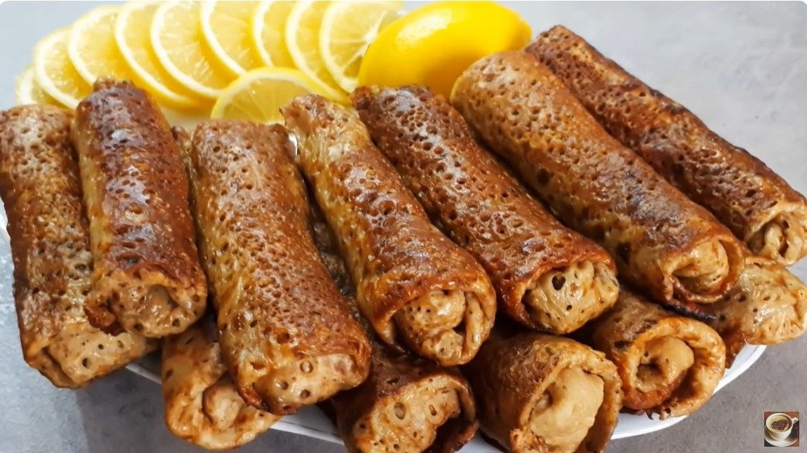 Нежные блинчики на кефире с мясом: идеальная закуска для праздничного стола
